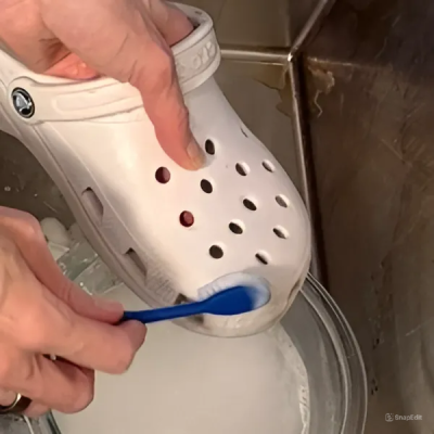 Clean white crocs with banking soda and vinegar paste